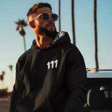 Load image into Gallery viewer, Black hoodie with 111 Angel Number design from Angel Numbers Merch Official, symbolizing new beginnings &amp; manifestation.
