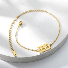 Load image into Gallery viewer,  Gold 555 Angel Number Ankle Bracelet from Angel Numbers Merch Official, representing transformation, courage, and embracing change.
